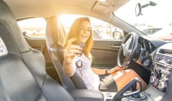 woman showing the keys inside a sport car. sexy business woman ready to drive. concept about leasing a car