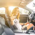 woman showing the keys inside a sport car. sexy business woman ready to drive. concept about leasing a car